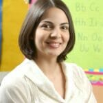 Lucy standing in a classroom