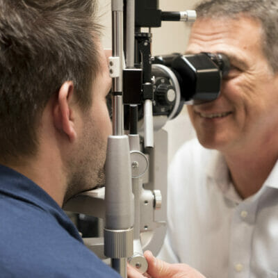 Man having an eye exam done with Dr. Bowers at Piedmont Eye Center